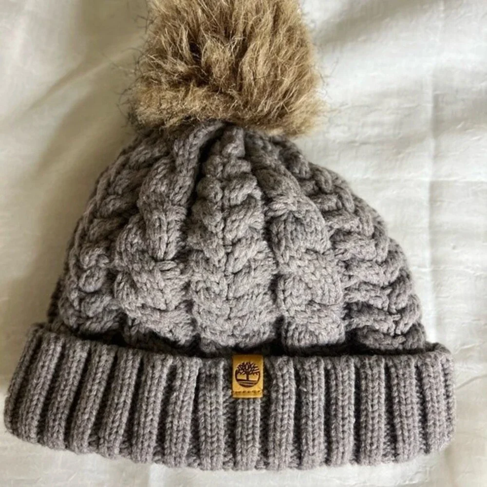 Timberland Women`s Cable Knit Cuff Pom Beanie  Fleece lined Color Gray